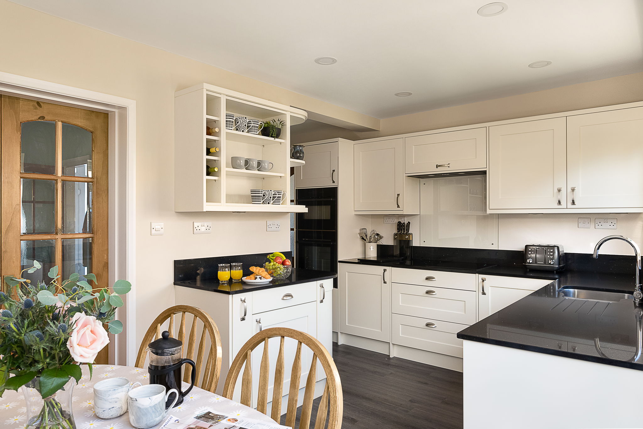 cream shaker kitchen with shelving